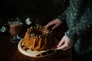 Rustic style carrot bundt cake with salt caramel and walnuts