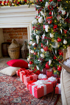 Stylish Christmas interior decorated in white and red colors