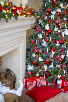 Stylish Christmas interior decorated in white and red colors