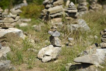 Harmony and balance, poise stones against the forest in the mountains, rock zen sculpture, sunny day