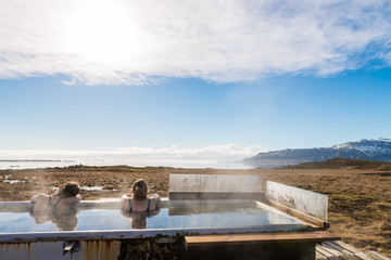 Icelandic hotpot among the amazing lagoon and mountains