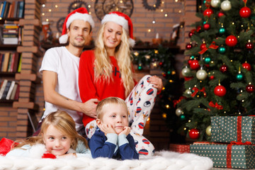 Family in pajamas on Christmas