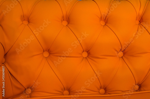 “Upholstery leather orange stylish sofa” Stock photo and royalty-free