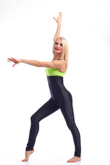 Fototapeta premium Attractive female gymnast exercising at studio 