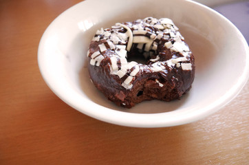 Fototapeta na wymiar Bite chocolate donut