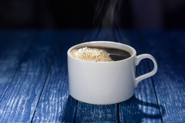 Coffee cup on wooden table.