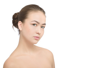 Woman with a natural beauty makeup look isolated over a white background with copyspace