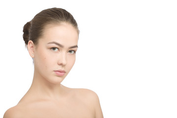 Fototapeta premium serious girl with a natural beauty makeup look isolated over a white background with copyspace