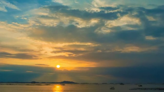 Time lapse of sunset sky at sea with Si Chang island background, Zoom out shot