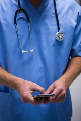 Surgeon using mobile phone in hospital