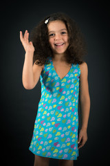 Fototapeta premium Beautiful girl doing different expressions in different sets of clothes: be careful