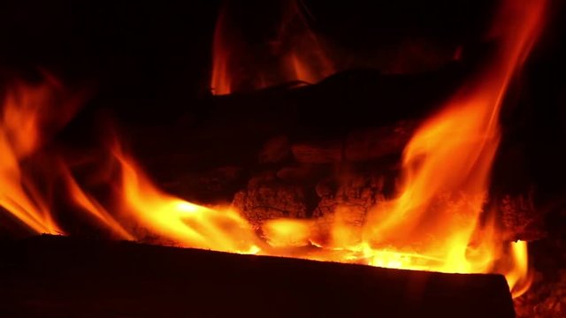 Burning wood logs in fireplace. Burning Fire background 