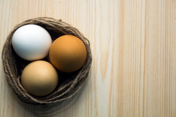 fresh eggs on a wooden background. Easter concept.
