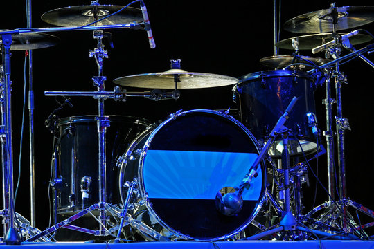 Drum set with bass drum, tom-toms, cymbals and microphones