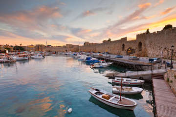Old harbor and city walls of the medieval town of Rhodes. - obrazy, fototapety, plakaty
