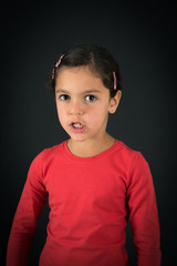 Beautiful girl doing different expressions in different sets of clothes: angry