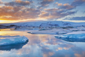 Icebergs in Jökulsárlón glacier lake at sunset