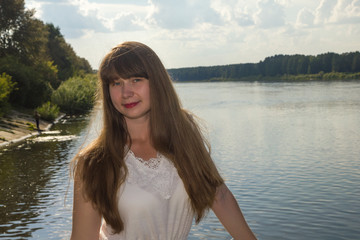 Fototapeta na wymiar long hairy women posture on river background