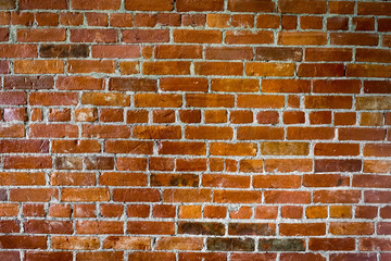 Orange brick wall with small bricks