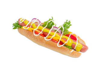 Hot dog with frankfurter and vegetables on a light background