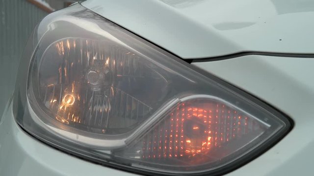 Front flasher light flashes yellow car