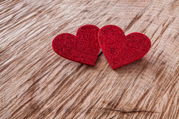 Valentine day background, wooden hearts on wood with copy space