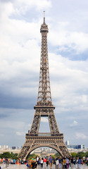 Fototapeta na wymiar Crowd of tourists on the Champ de Mars near the Eiffel Tower.