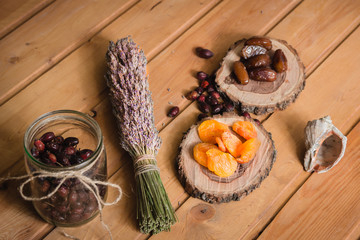 dried fruits on wooden plates and berries