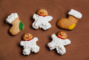Fototapeta na wymiar Christmas homemade cookies with cream on wooden background
