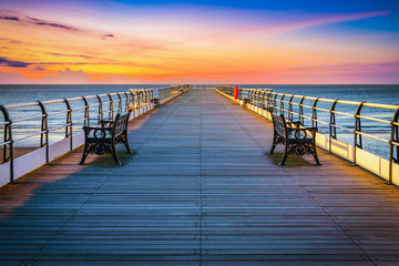Fototapeta premium Sunset pier at Saltburn by the Sea, North Yorkshire, UK