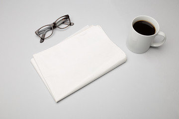 Set of glasses, newspapers and coffee cup