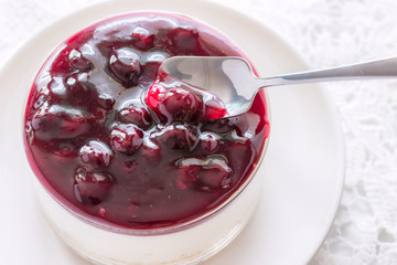 Blueberry cheese cakes served in glass ramekins