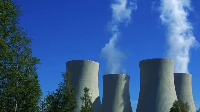 factory (nuclear power station) - smoke from chimney with trees