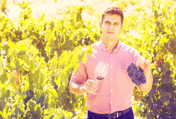 Vintner with glass of wine