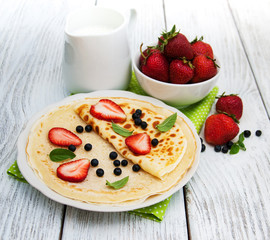 crepes with strawberries and blueberries