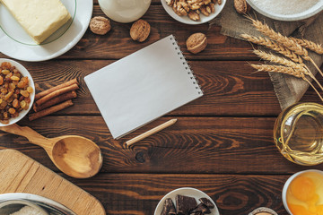 top view of wooden rustic kitchen board with organic ingr