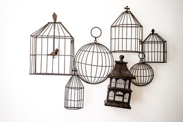 Bird cages hanging on the wall