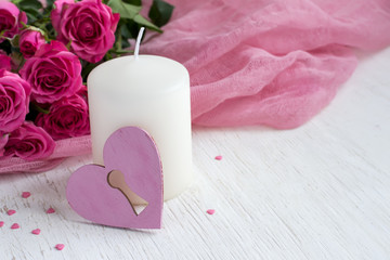 Valentine's day concept with heart, candle and roses