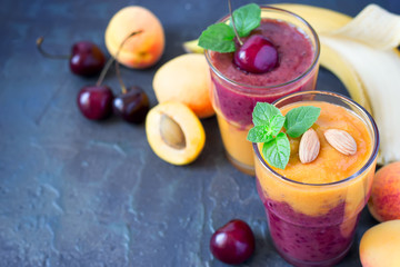 Colorful smoothies from apricots, cherries and bananas