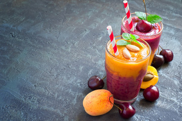 Colorful smoothies from apricots and cherries, copy space