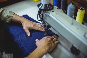 Shoemaker using sewing machine