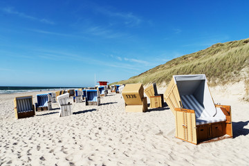 Fototapeta na wymiar Beach chairs at Wenningstedt Beach / Germany