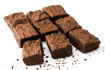 Chocolate brownie with chocolate syrup isolated on white background
