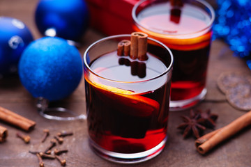 Hot mulled wine with spices, gift box and christmas balls 