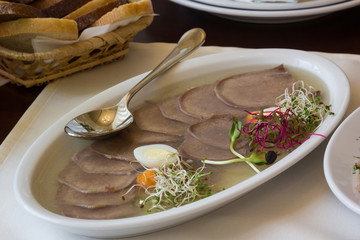 Beef tongue in jelly on table in restaurant