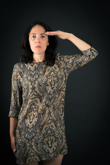 Beautiful woman doing different expressions in different sets of clothes: at attention