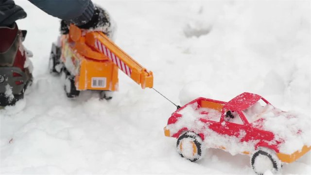 Toy cars in snow/play with toy cars in the snow in winter