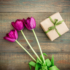 Tulip flowers and gift. Flat lay, Top view