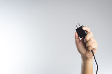 Electric phone adapter in a hand