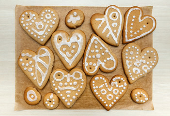 Heart shape home made ginger bread cookies decorated with various white sugar glazing
